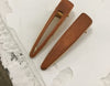 Various geometric hollow hair clips made of wood